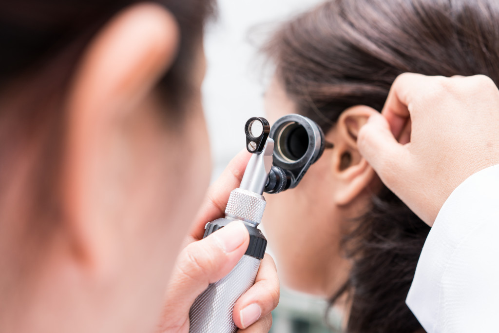 Doctor examined the patient's ear with Otoscope. Patient seem to have problems with hearing