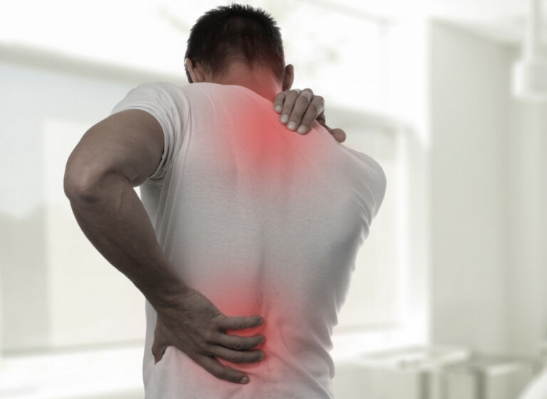 man with back pain sore mucles