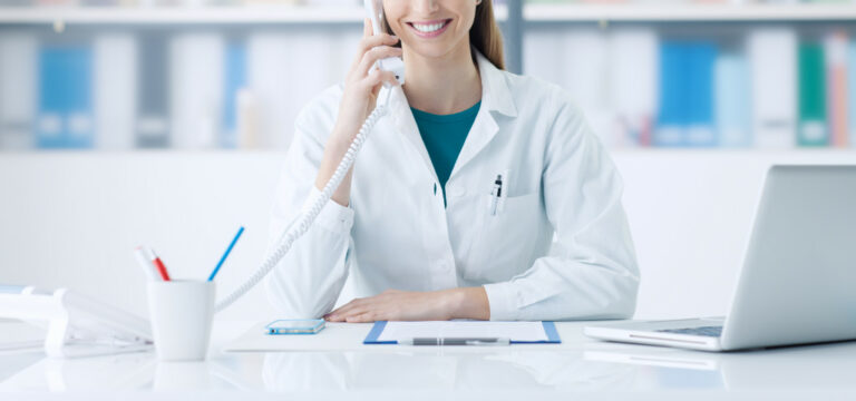 A medical professional on the phone in a clinic